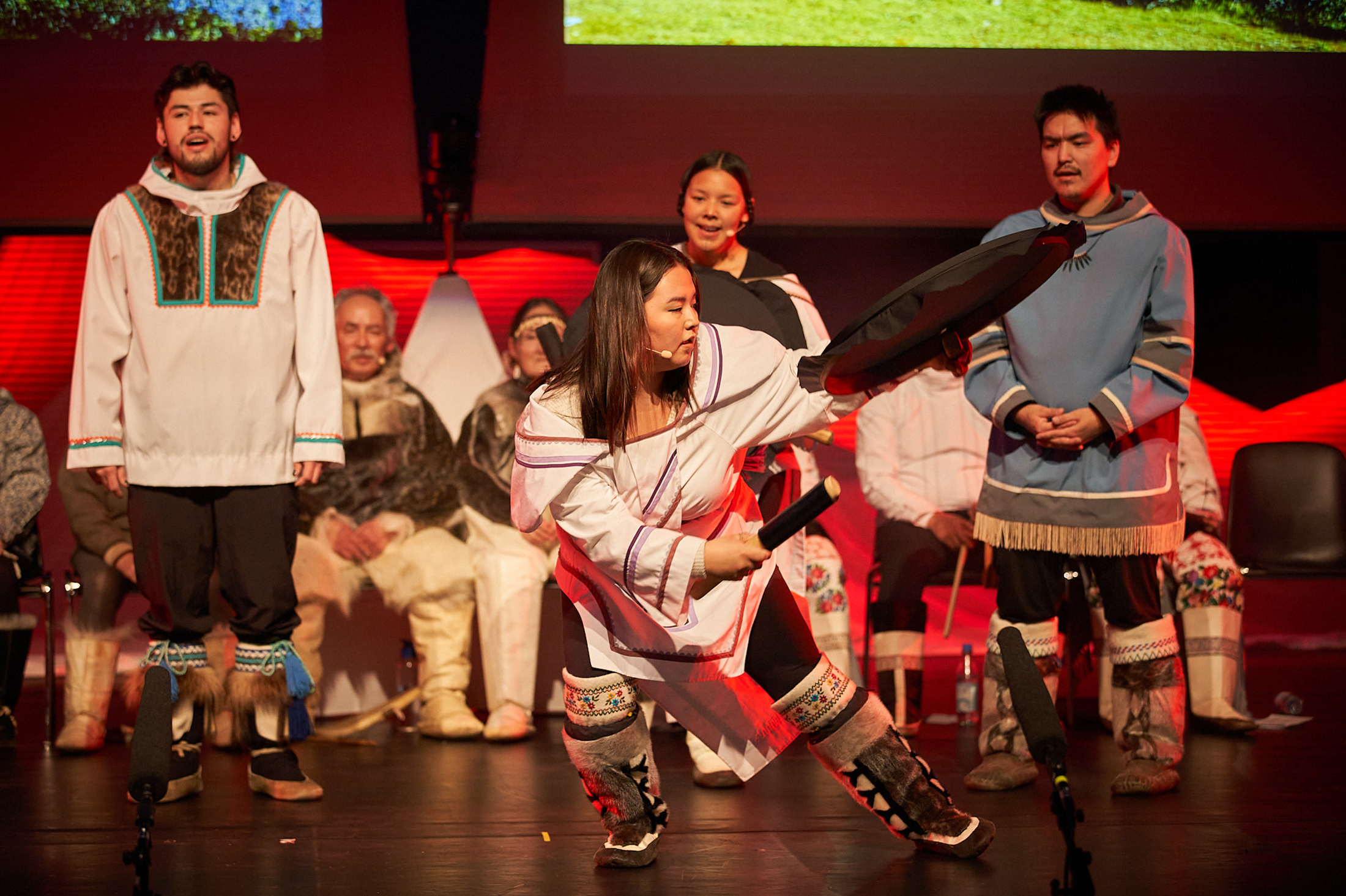 Inuit performers carrying out the traditional drum dance in Nunavut.