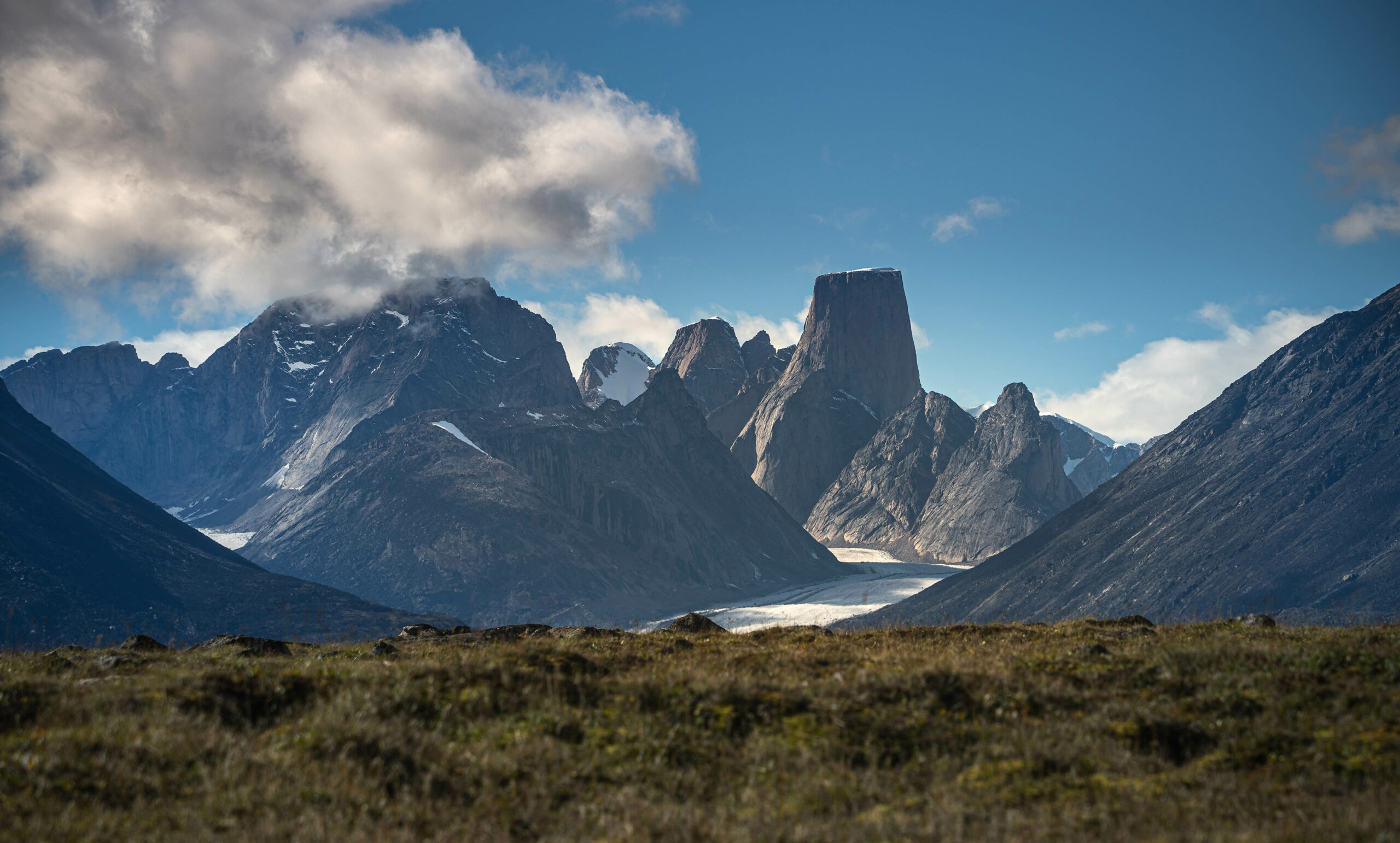 Picturesque image of Mount Thor in Nunavut on a sunny day with large vista.